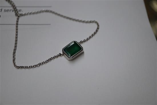 An 18ct white gold and solitaire emerald set pendant necklace, pendant 9mm.